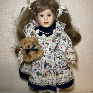 Porcelain Doll with Brown Hair and Teddy Bear